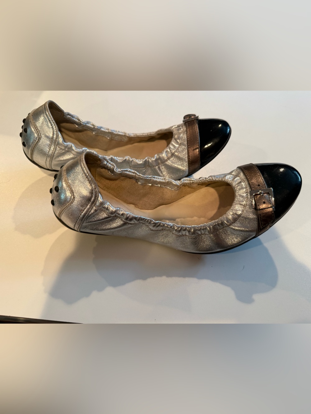 Women’s Tod’s Metallic Silver Ballet Flats with Black Cap Toe size 6